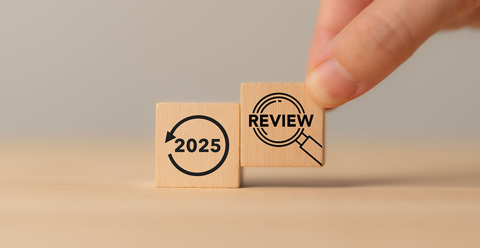 Two wooden blocks representing the 2025 packaging regulations review